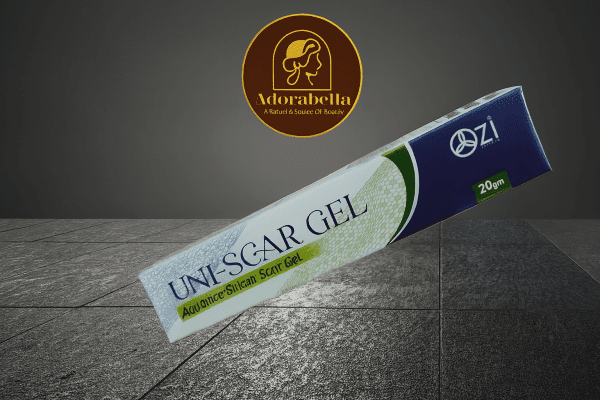 Uni-Scar Gel 20gm tube and box on white table with Adorabella logo and green natural background